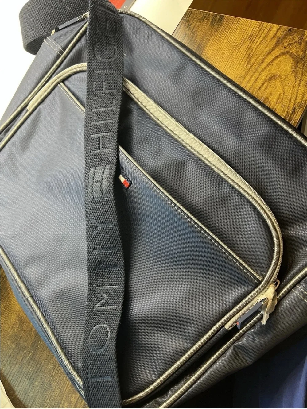 NEW Tommy Hilfiger Navy Messenger Bag with Front Pocket + Audio Cord Opening
